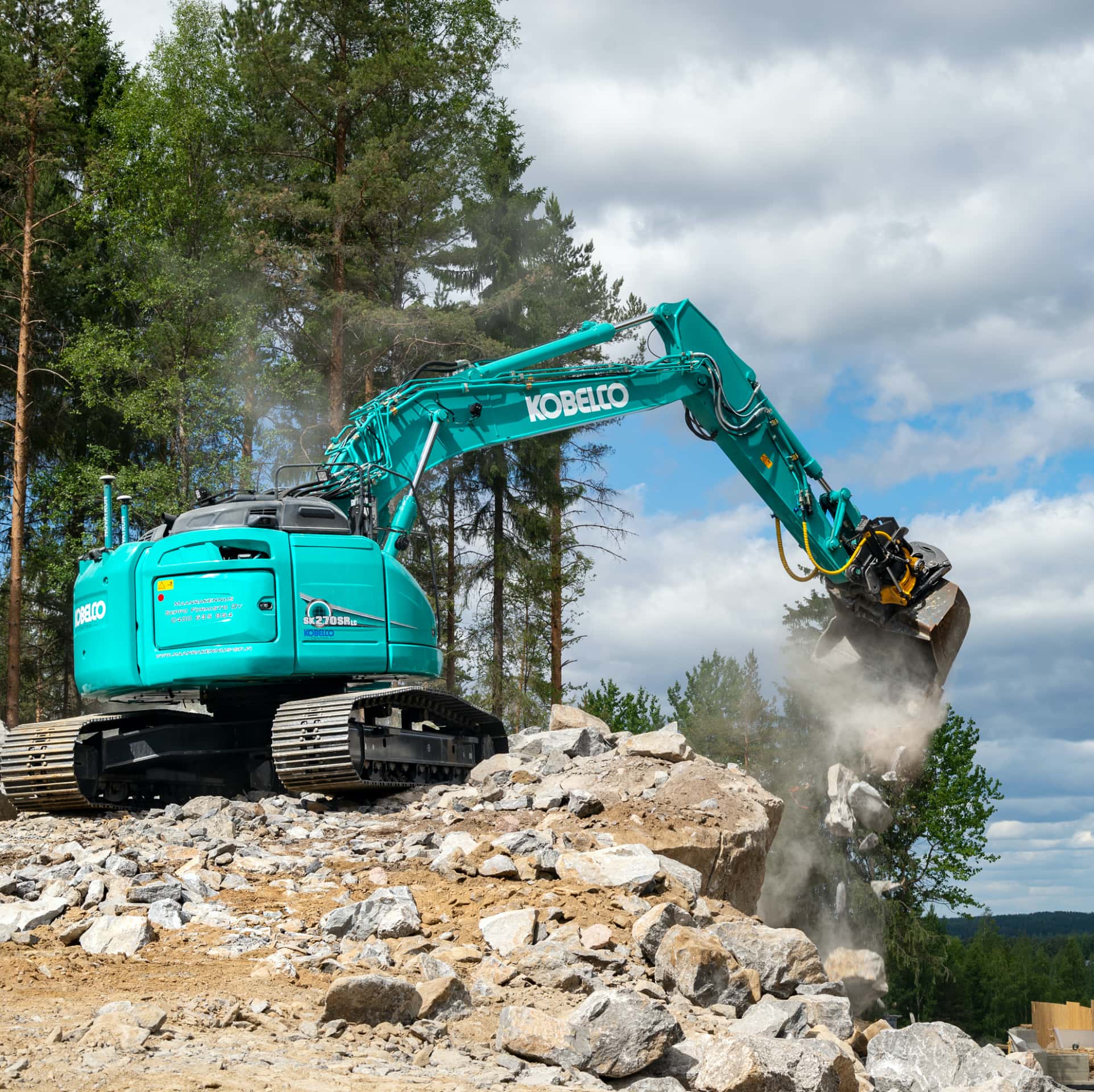 excavator dropping dirt