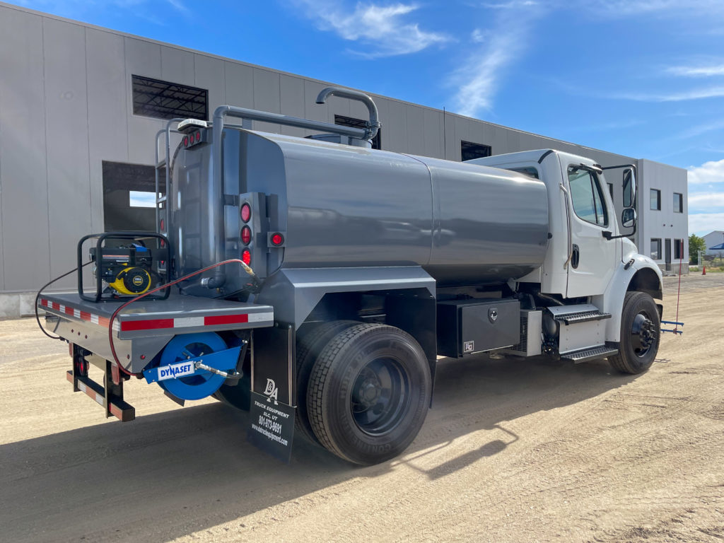 Freightliner M2 tank truck in the US with street washing equipment.