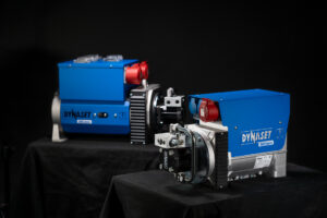 Two DYNASET Hydraulic generators assembled in a product photoshoot set with a black background.