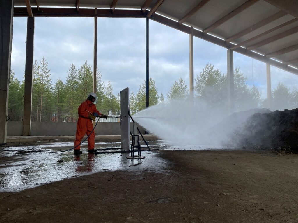 Demonstration of HAC Hydraulic Abrasive Cutting System piercing through a metal fire door.