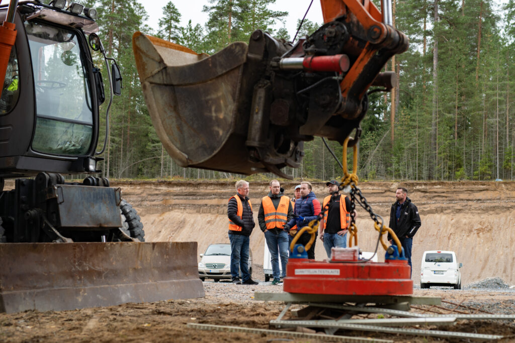 excavator with magnet generator