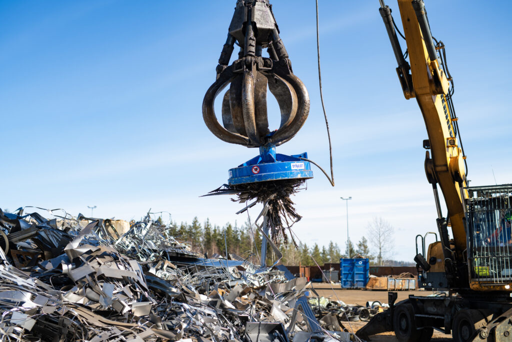 MAG Lifting Magnet handling scrap metal at a recycling yard