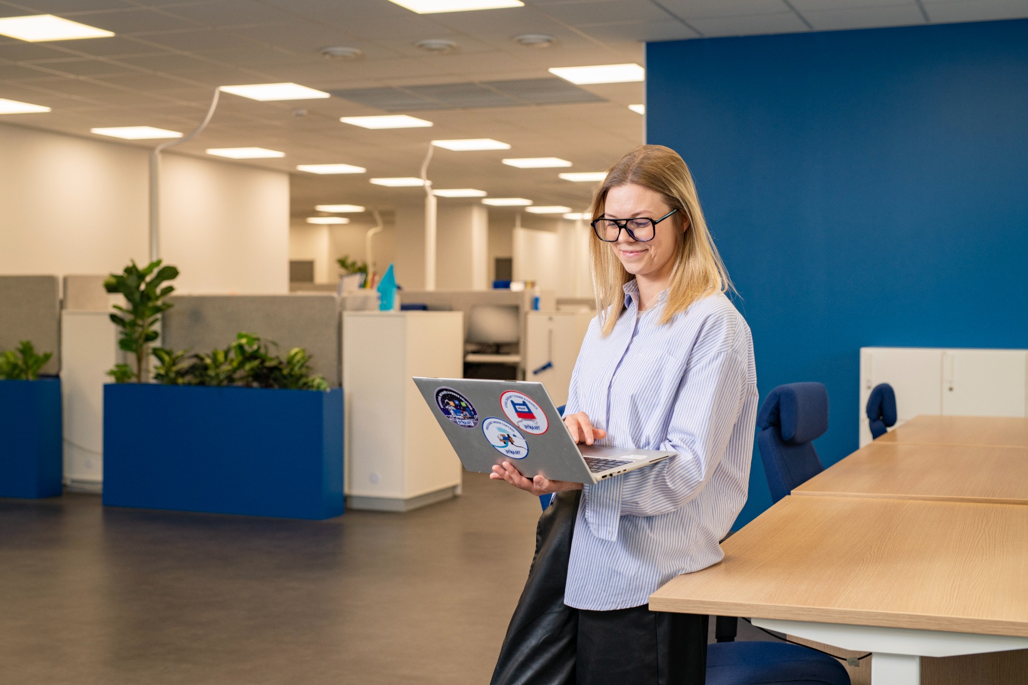 Finance Coordinator Hanna Reinola using a laptop at the Dynaset office.